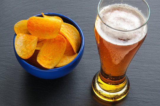 Beer and many yellow saddle chips