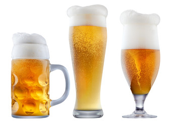 Mug of frosty light beer with foam isolated on a white background
