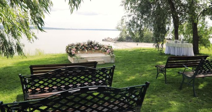 Wedding set up in garden, park. Decoration of flowers. Wedding ceremony in forest.