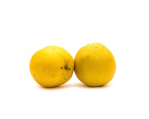 Studio shot two California apple pears (Asian pear, pyrus pyrifolia) isolated on white background. It has the shape and texture of an apple but the flavor of a pear.