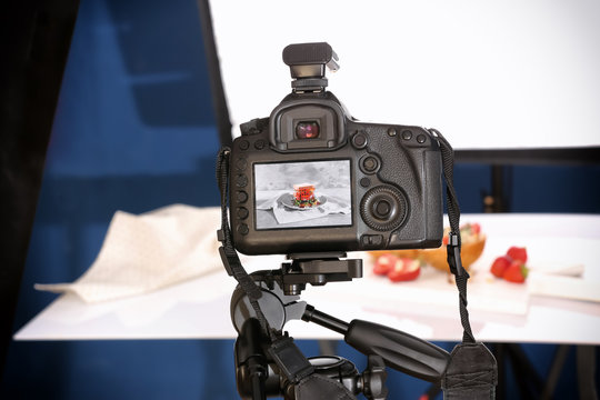 Professional camera on tripod while shooting food