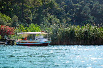 Fototapeta na wymiar Picturesque view of motor boat on river in sunny summer day