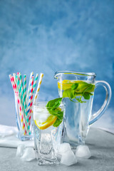 Basil water in glassware on table