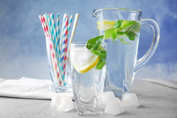 Basil water in glassware on table