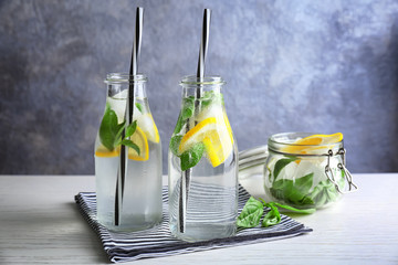 Basil water in glassware on table