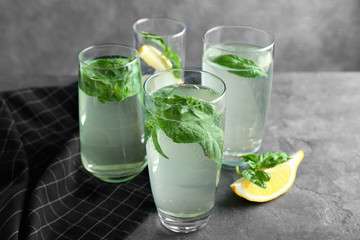 Basil water in glasses on table