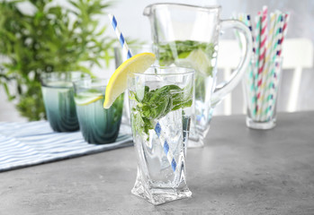 Basil water in glassware on table