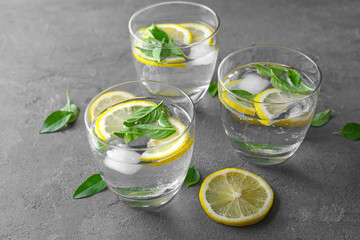 Composition with glasses of basil water on table