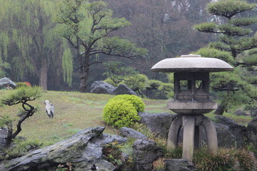 Asian shrine and bird at rainy location