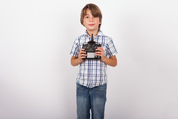 Boy holding his drone remote control proudly