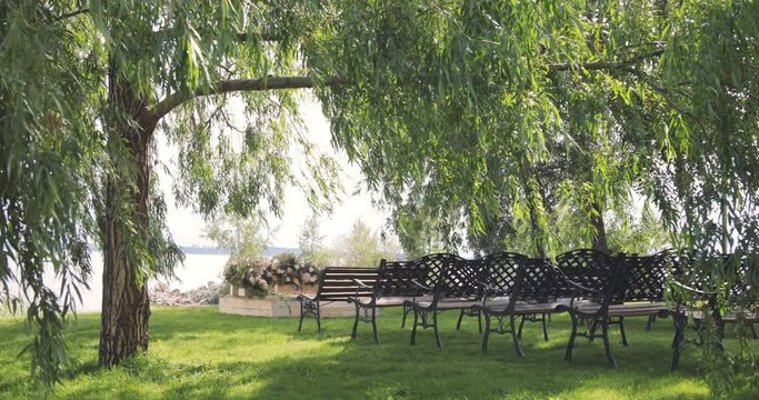 Wedding set up in garden, park. Decoration of flowers. Wedding ceremony in forest.