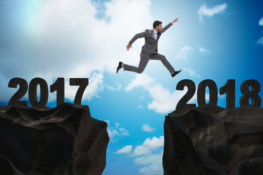 Businessman looking forward to 2018 from 2017