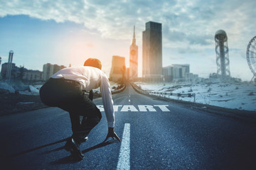 Rear view of business person in ready position on start line to compete