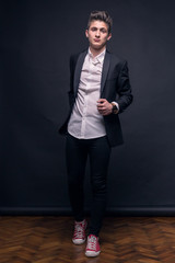 Fototapeta premium one young teenage boy, posing suit