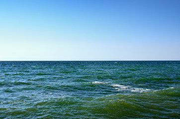 Waves of the Black Sea against the blue sky. Seascape, sea in the summer.