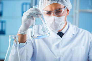 Female scientist researcher conducting an experiment in a labora