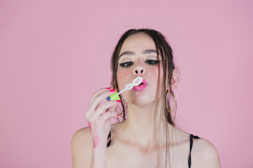 Woman play with soap balloon.