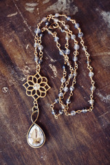 Beautiful romantic necklace on the wooden table