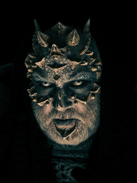 Man with dragon skin and grey beard