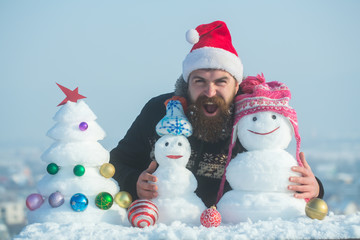 Santa man shouting with snowy sculptures