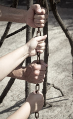 Hands holding and pulling a stick