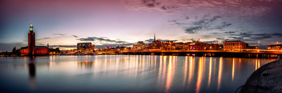 Stockholm sunset skyline with City Hall as seen from Riddarholmen. Panoramic montage from 13 images