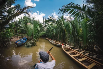 Papier Peint photo autocollant Rivière Tourist attraction - mekong delta boat tour. Exotic holidays in Vietnam.