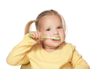 Cute little girl brushing teeth, isolated on white