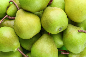 Delicious ripe pears as background