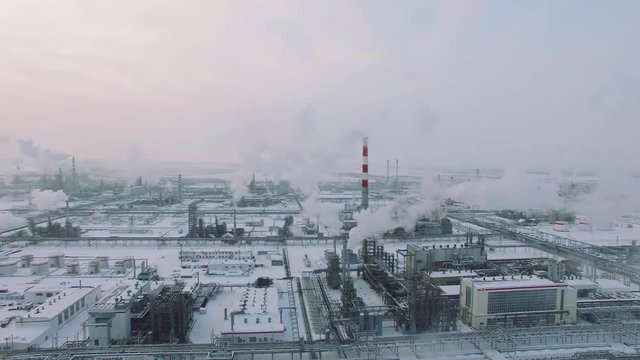 Aerial view of gas processing plant at winter time. Cold morning at industrial zone