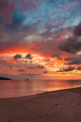 Fototapeta na wymiar Beautiful vivid sunset at paradise beach Borneo Malaysia
