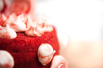 red velvet cake, decorated with white and red meringues, white background, close, velor, idea for a holiday