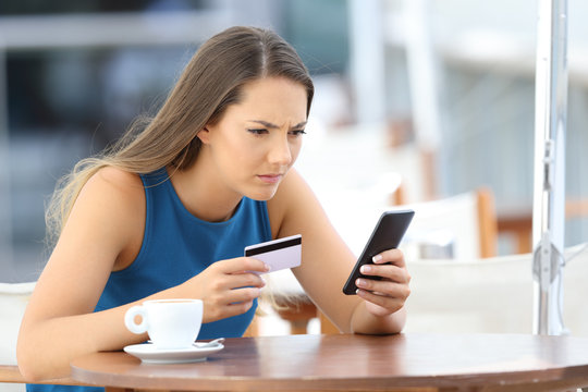 Worried girl having problems paying on line
