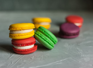 Sweet and colorful french macaroons or macaron on gray background, Dessert.