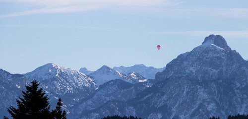 Alpen panorama with hot air ballon in winter
