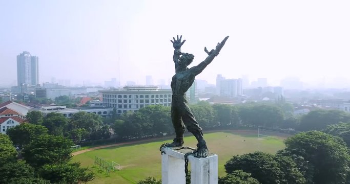 JAKARTA, Indonesia. September 14, 2017: Beautiful aerial view of West Irian liberation statue symbol in Jakarta, Indonesia. Shot in 4k resolution