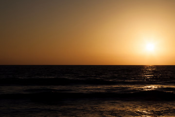 Fototapeta premium Sunset Golden Sky Over Dark Ocean Waves