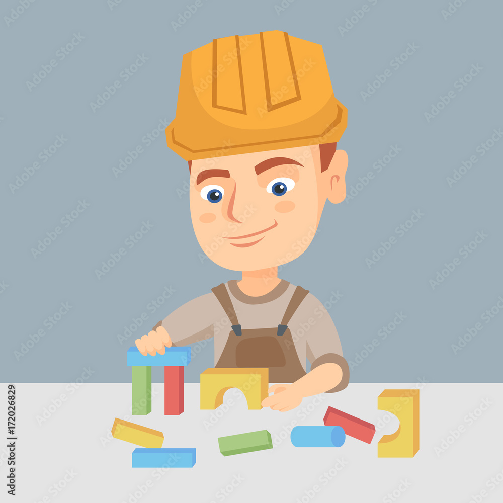Poster little caucasian builder boy in a hard hat playing with building cubes toy. happy smiling builder bo