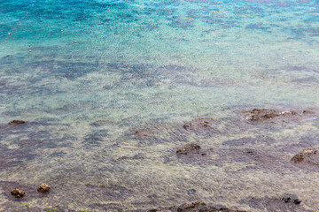 Beautiful reef and coral in shallow blue sea in day time, high angle view of seascape