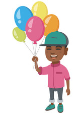 African-american smiling happy boy with the bunch of colorful air balloons in his hand