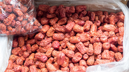 Dried red date or Chinese jujube. Traditional herbal medicine spill at market