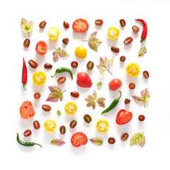 Food collage of fresh vegetables, top view. Tomatoes in a cut, pepper, autumn leaves isolated on white background. Abstract composition of vegetables in a square format. Сoncept of healthy eating.
