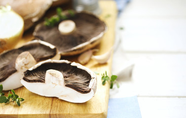 Fresh raw shiitake mushrooms on cooking board