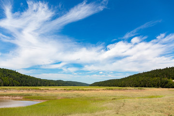 Obraz premium clouds with blue sky and mountain and field