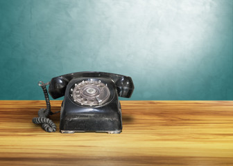 old classic vintage dial telephone on wooden table, communication