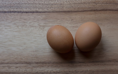 chicken eggs on hard wood cutting board