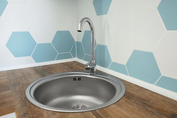 Sink in light modern kitchen