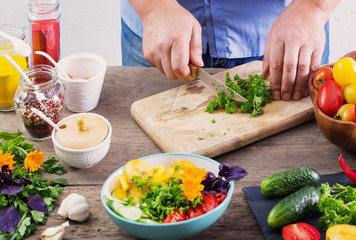 man cooking a vegetarian salad
