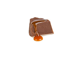 a slice of chocolate in caramel isolated in a white background