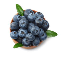 blueberries in wooden bowl isolated on white background. top view